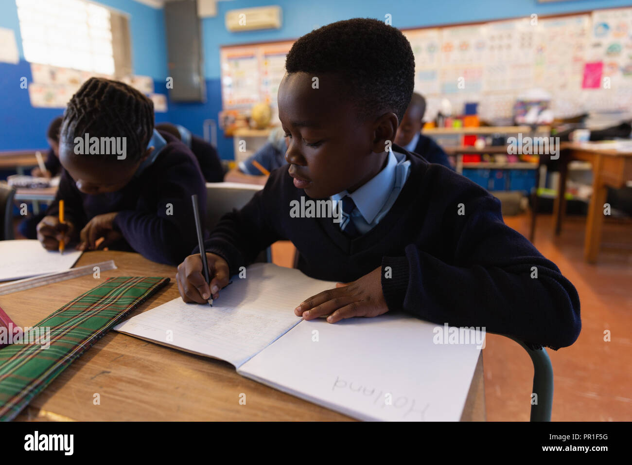 Students studying in the classroom Stock Photo - Alamy
