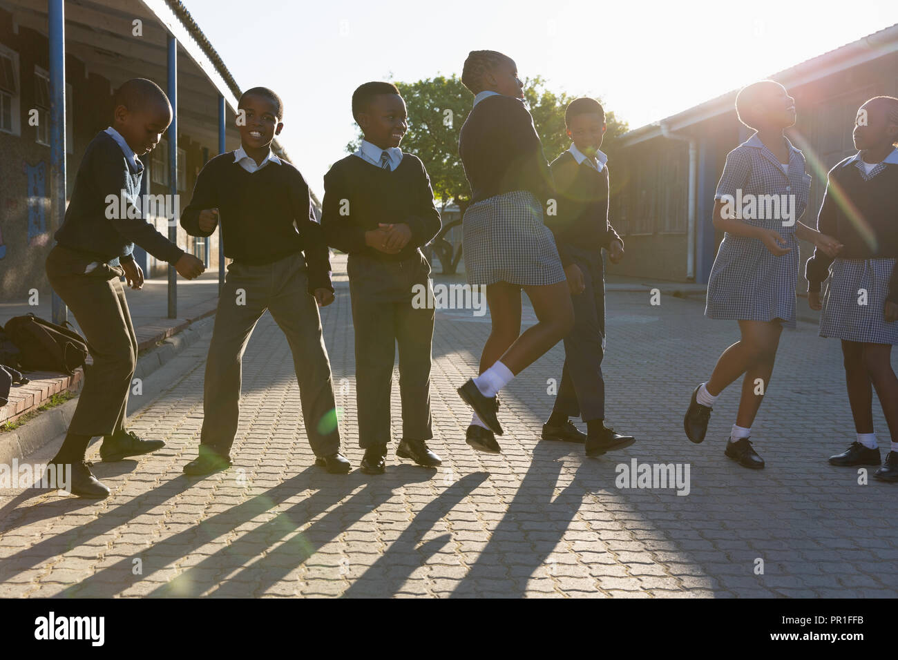 Schoolkids having fun in school campus Stock Photo