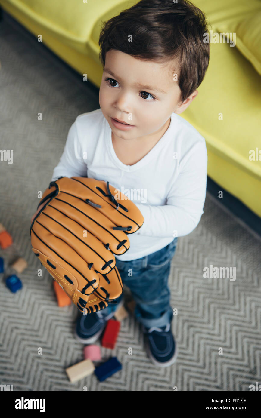 little boy playing with baseball glove Stock Photo Alamy