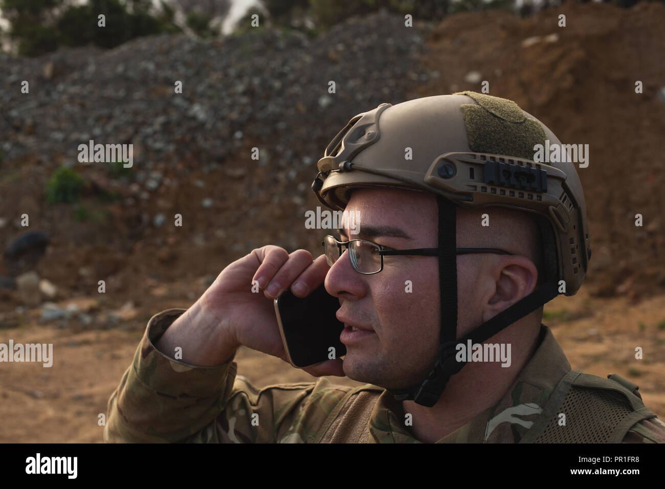 Military soldier talking on mobile phone Stock Photo