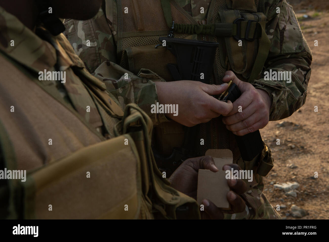 Military soldiers holding magazine during military training Stock Photo