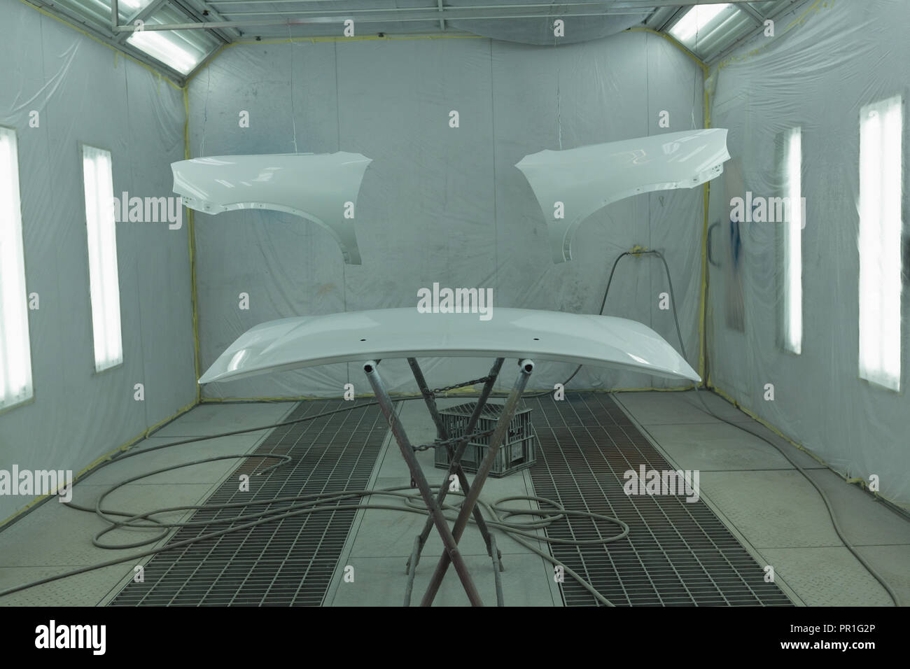 Painted car parts in garage Stock Photo Alamy