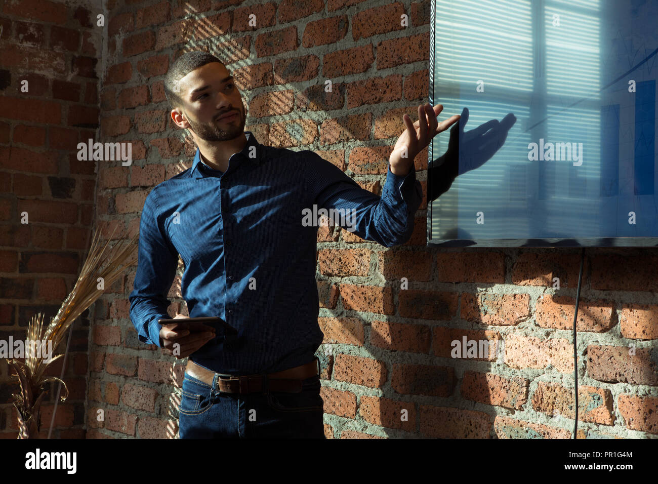 Executives giving presentation on screen Stock Photo