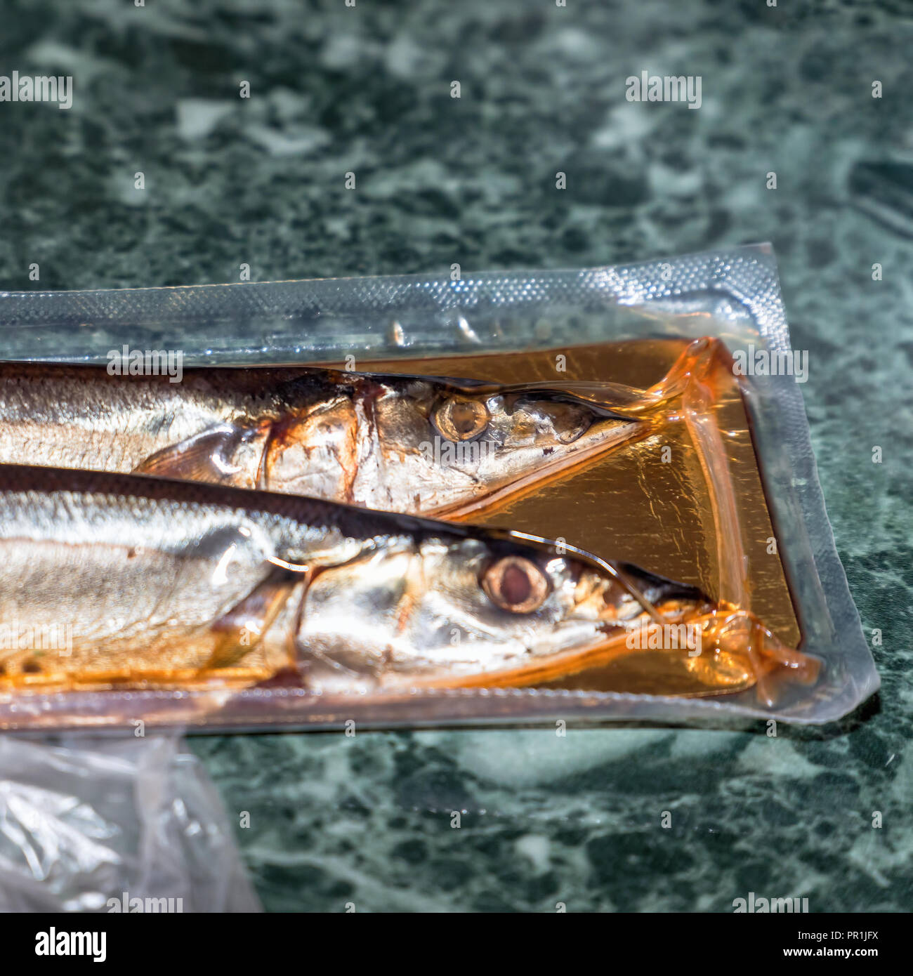 Sea fish saury in vacuum packaging Stock Photo Alamy