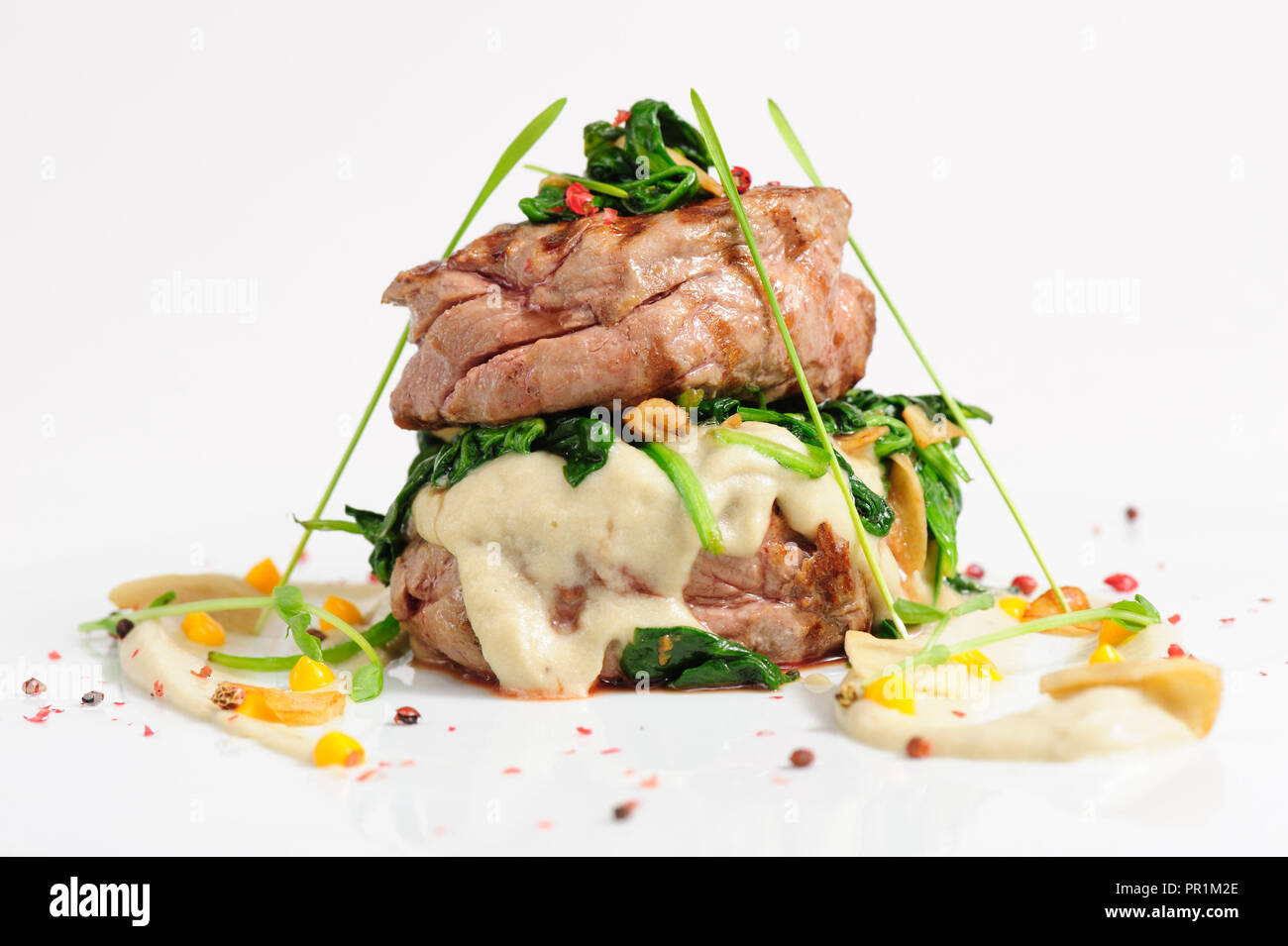 Veal medallions with spinach Stock Photo
