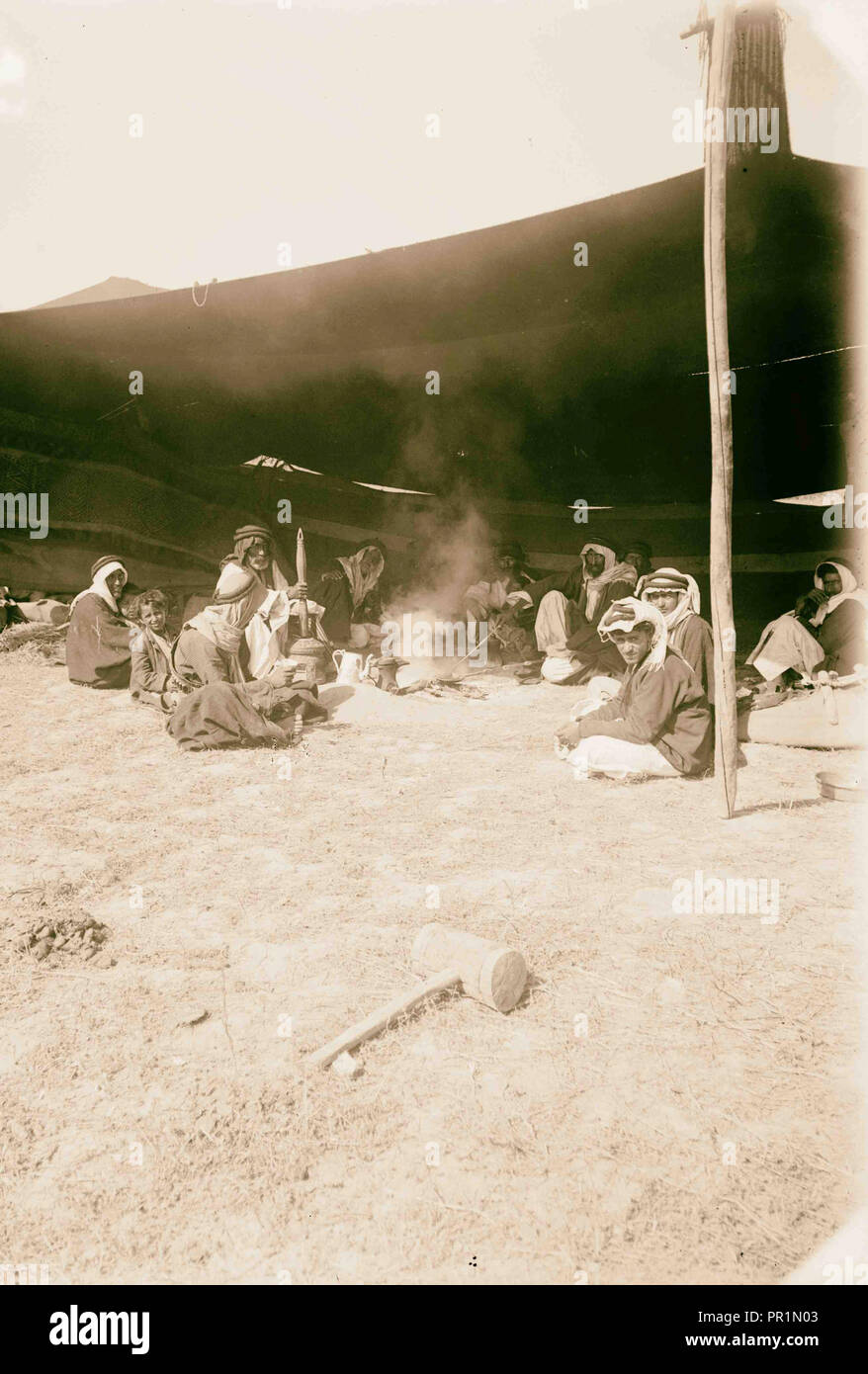 Trans-Jordan types. Hospitality. (Drinking coffee in the Sheik's tent). 1898, Jordan Stock Photo