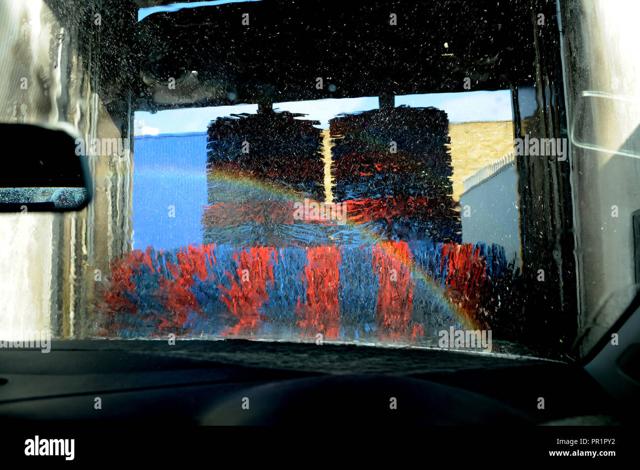 VW Polo going through a car wash on the Old Kent Road, London Stock