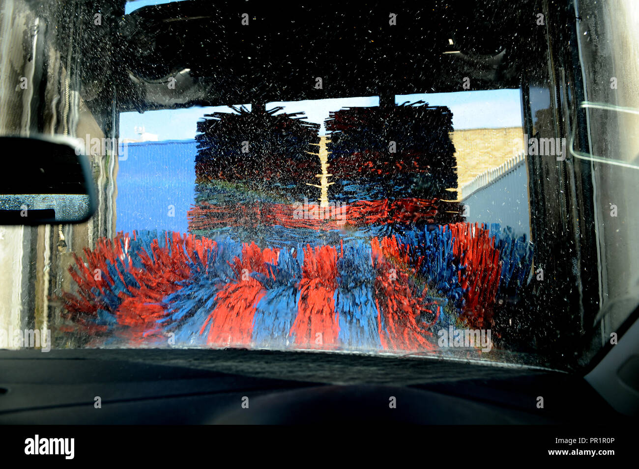 VW Polo going through a car wash on the Old Kent Road, London Stock