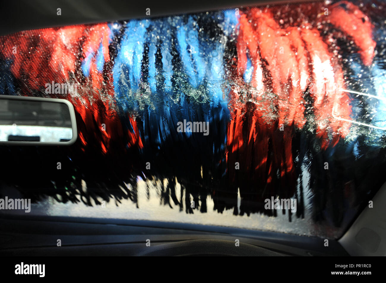 VW Polo going through a car wash on the Old Kent Road, London Stock