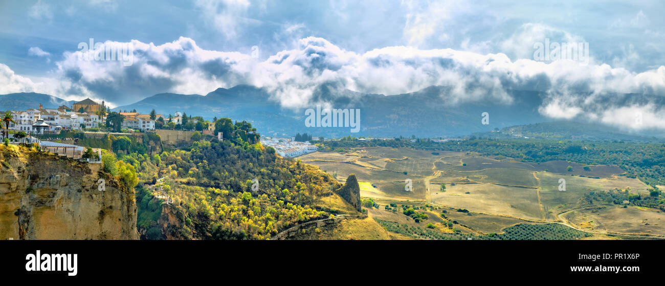 Panoramic landscape with view of old town and beautiful valley at Tajo Gorge in Ronda. Andalusia, Spain Stock Photo