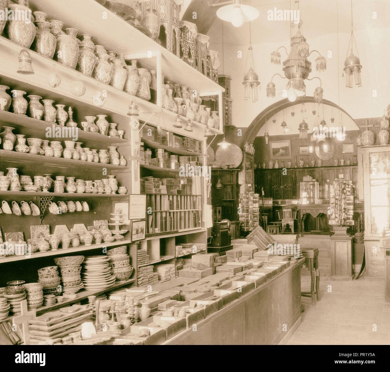 Typical oriental store, faience and brass articles. 1925 Stock Photo