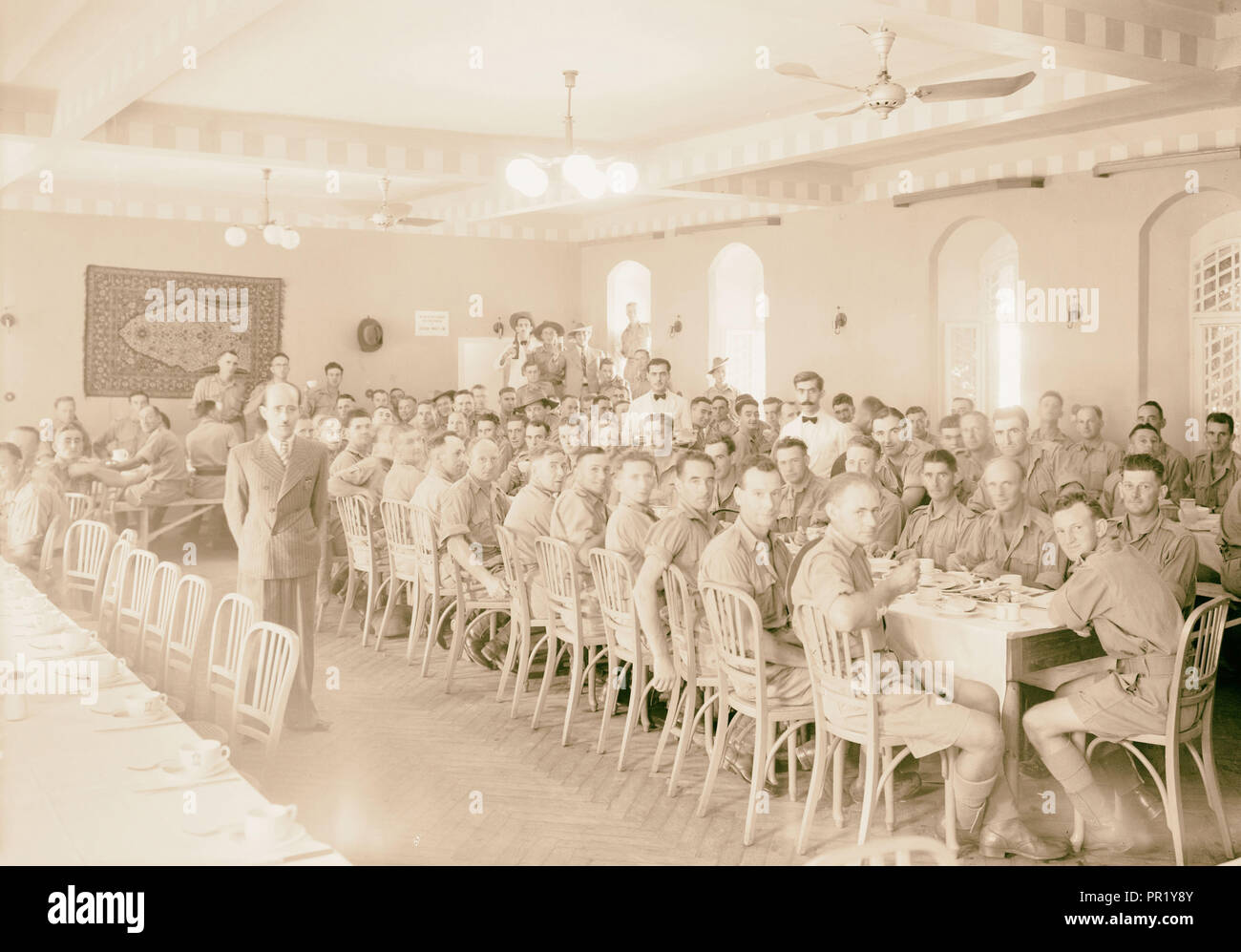 Australian soldiers at lunch in Austr. Club dining hall (old East Hotel). 1940, Jerusalem, Israel Stock Photo