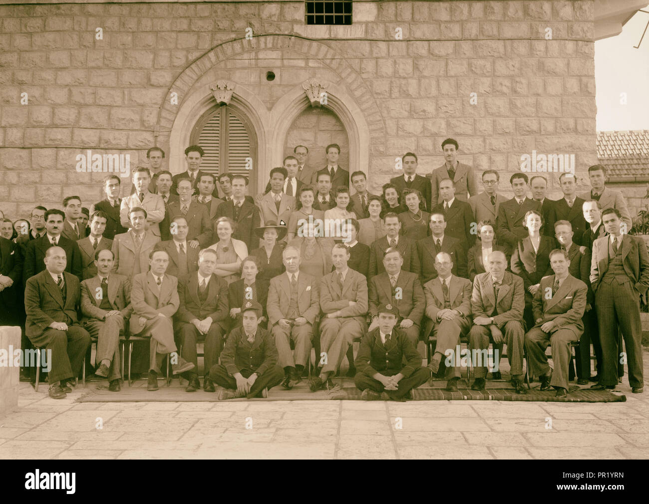 Group at P.B.S. [i.e., Palestine Broadcasting Service], Mr. Pastou's farewell, Mar. 1942. 1942, Jerusalem Stock Photo