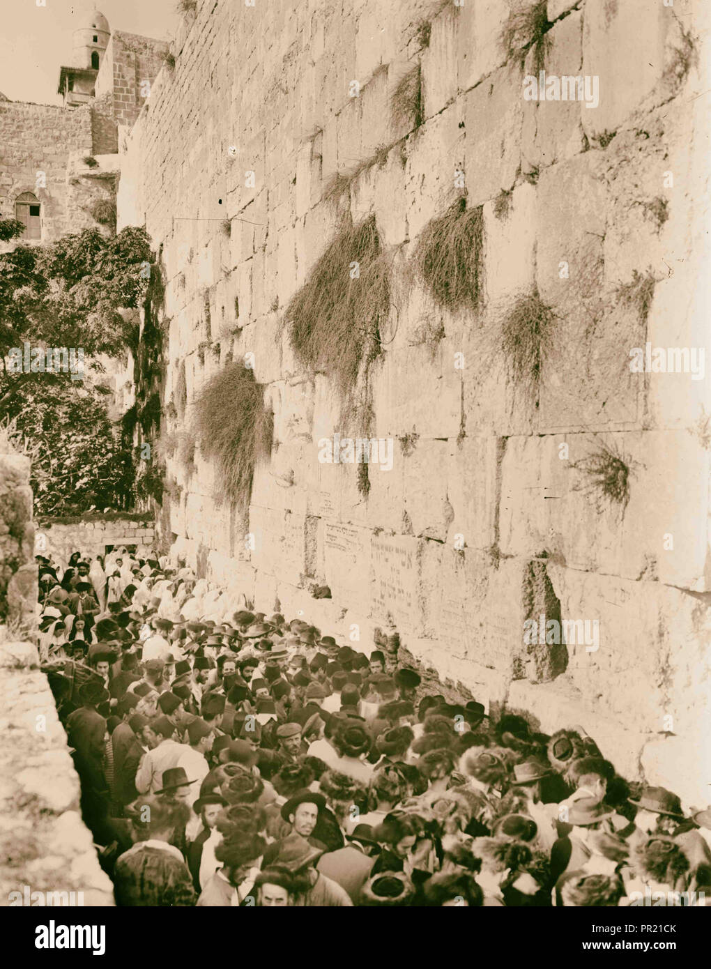 Crowds on Atonement Day at western Temple wall. Jew's wailing place. 1920, Jerusalem, Israel Stock Photo
