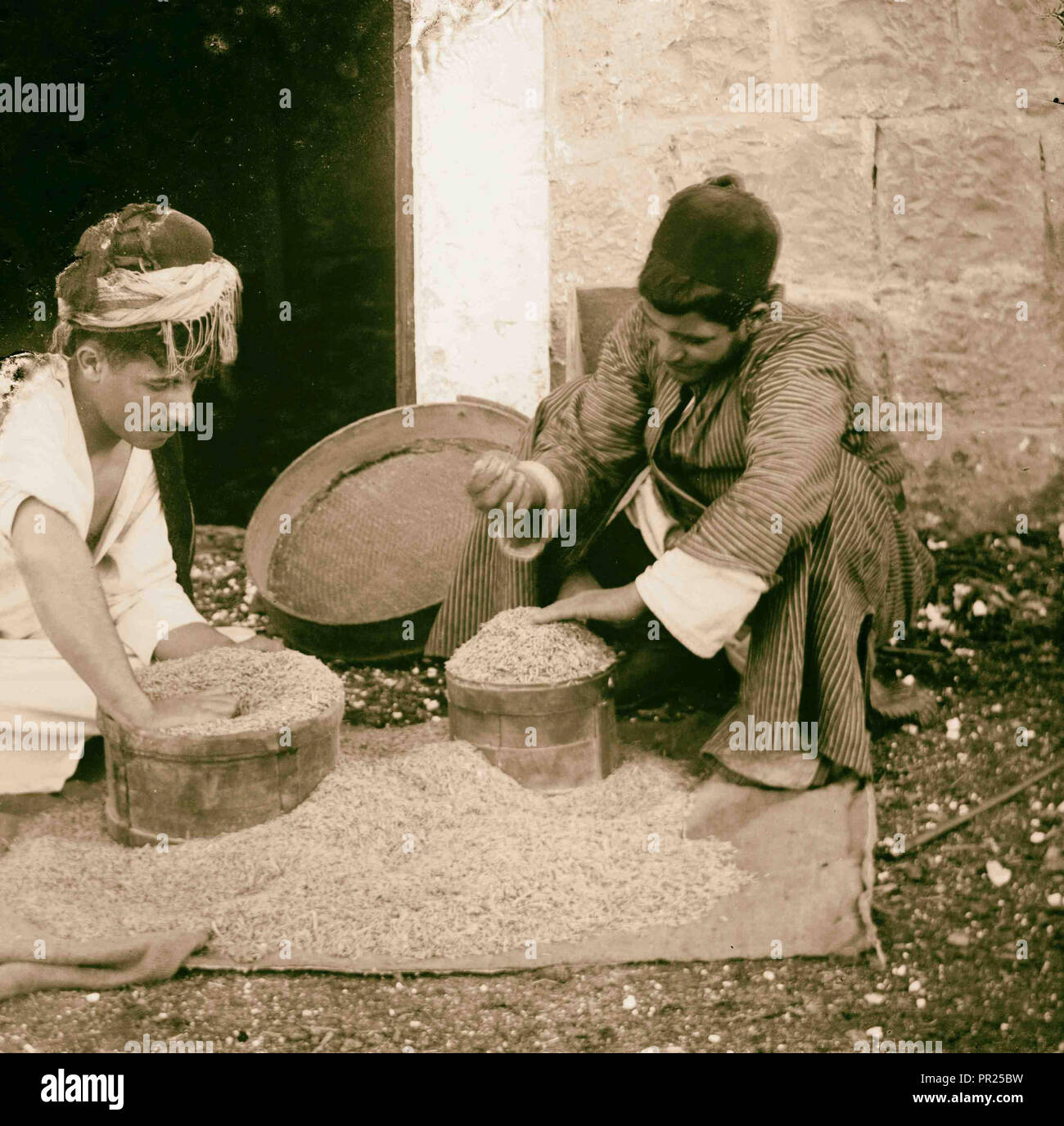 Costumes, characters and ceremonies, Measuring wheat. 1898, Middle East ...