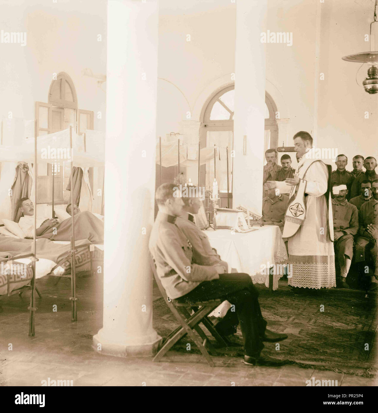 Priests serving Mass to patients, International Red Cross and Red Crescent  Movement Headquarters, Jerusalem 1915, Israel Stock Photo - Alamy
