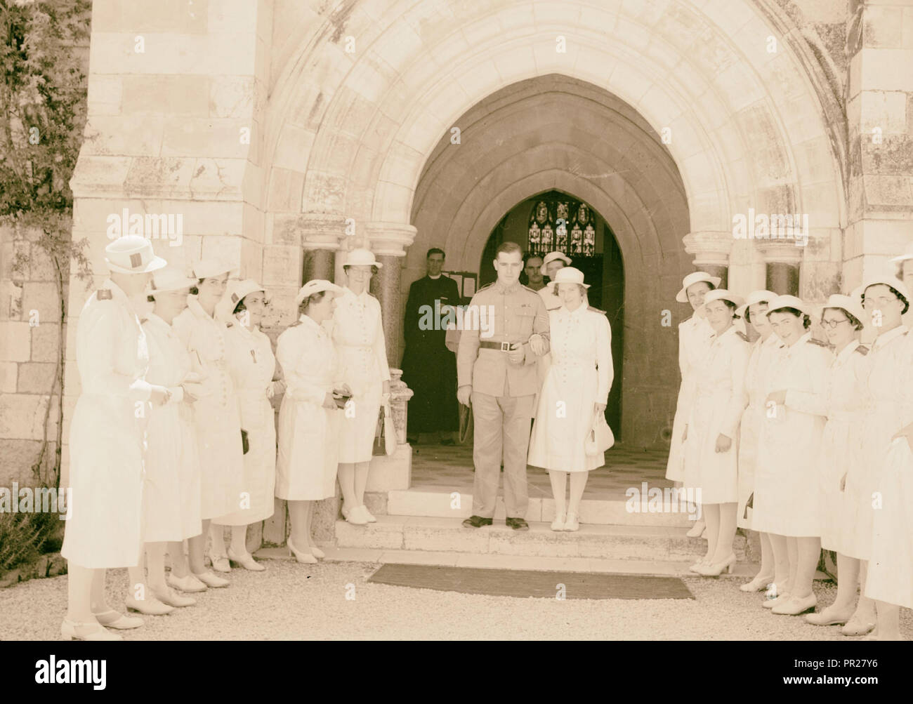 Wedding at St. George's Cathedral on June 3, 1942. Bride & groom coming out of church with 'Guard of Honor' of nurses. 1942 Stock Photo