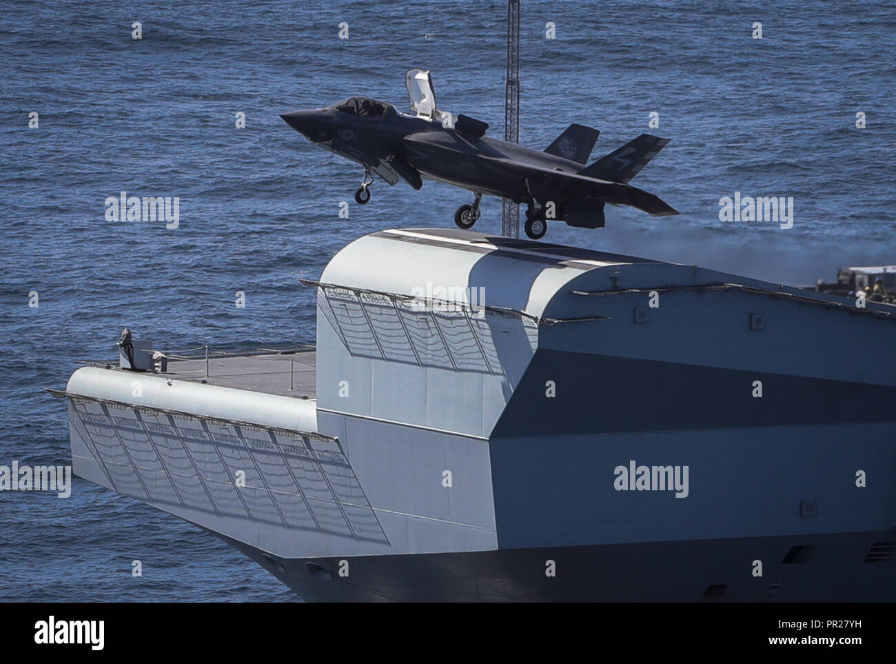 Royal Navy Cmdr. Nathan Gray, F-35 Integrated Test Force at NAS Patuxent River, Md., makes the first ever F-35B Lightning II takeoff from HMS Queen Elizabeth. Two F-35Bs landed onboard the new British aircraft carrier this week laying the foundations for the next 50 years of fixed wing aviation in support of the UK’s Carrier Strike Capability.  Courtesy photo by Royal Navy Stock Photo