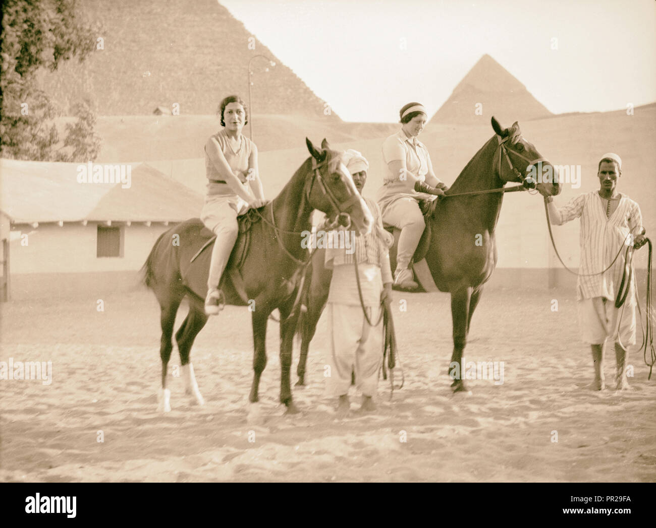 Egypt. Cairo. Hotels. Mena House. Guests riding near the Pyramids. 1934, Egypt, Cairo Stock Photo