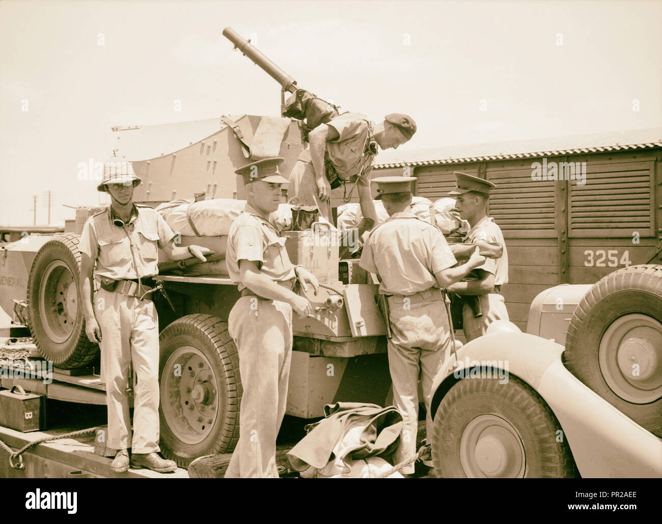 Eleventh Huzars arriving at Ludd. Armoured car being unloaded from train, Israel, Lod Stock Photo