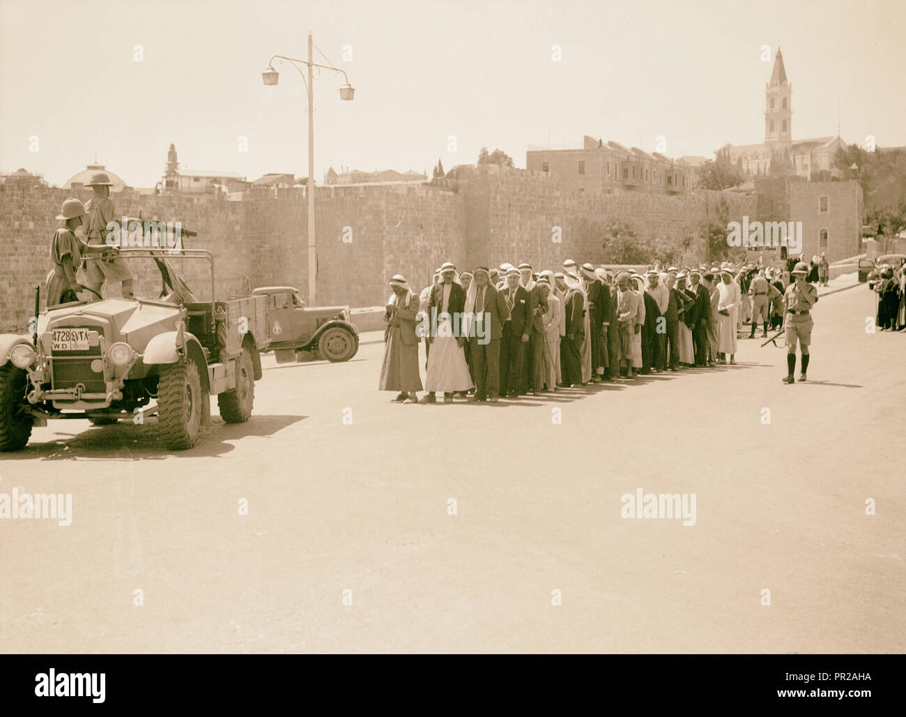 Search for arms en masse outside Damascus Gate, Sept. 9, '38. Citizens covered with machine-gun while being searched. Stock Photo