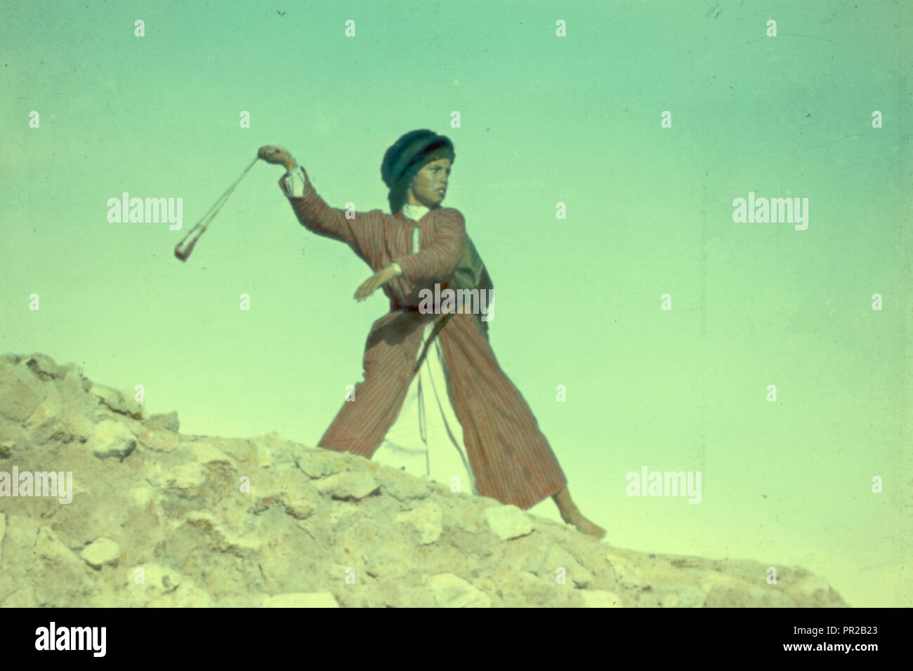 Shepherd boy slinging, (A modern David). 1950, Middle East Stock Photo