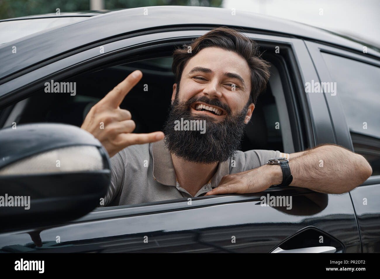 Man Happy To Drive His New City Car Cheerful Car Driver Making