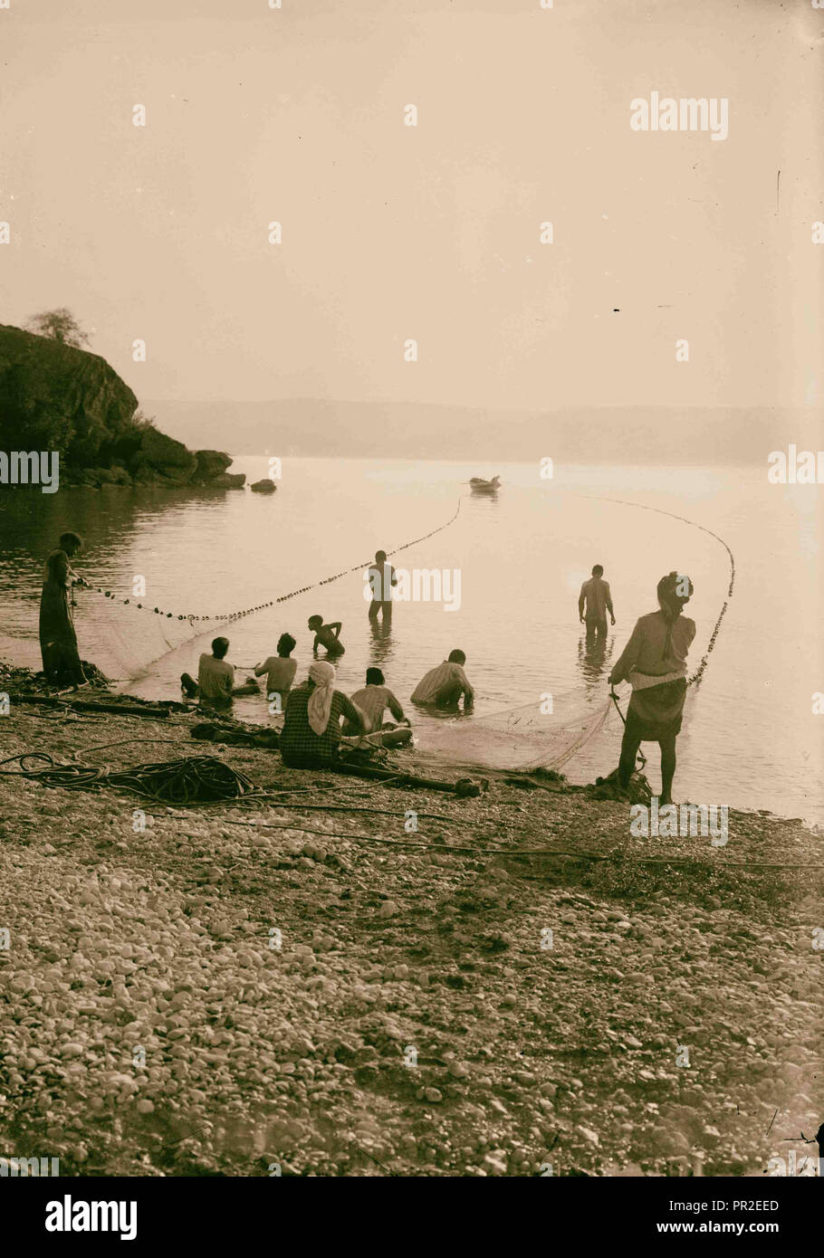 Choice set of thirteen slides, illustrating the Sea of Galilee and its fishermen still 'toiling with their nets.' Stock Photo