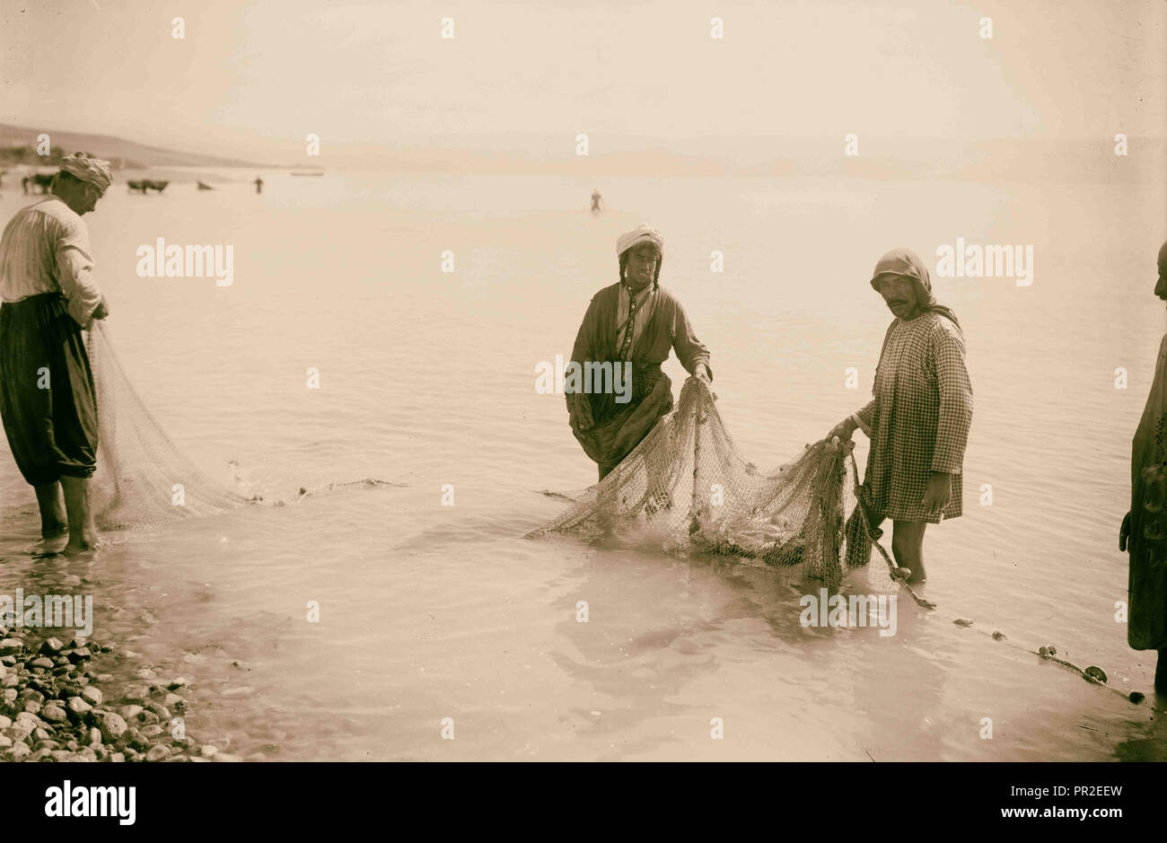 Choice set of thirteen slides, illustrating the Sea of Galilee and its fishermen still 'toiling with their nets.' Stock Photo