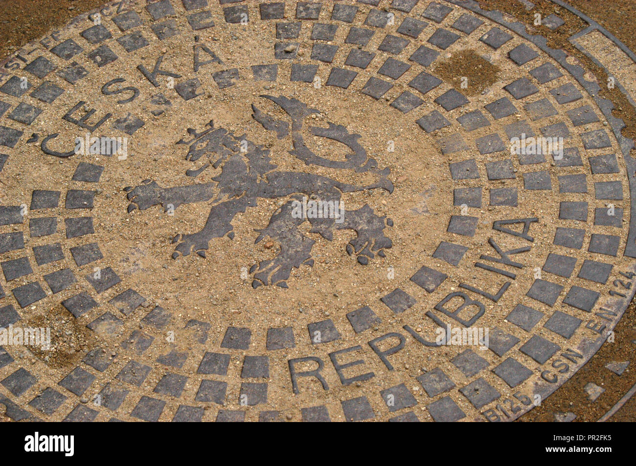 Bohemian heraldic lion depicted on the manhole cover in Prague, Czech Republic. Stock Photo