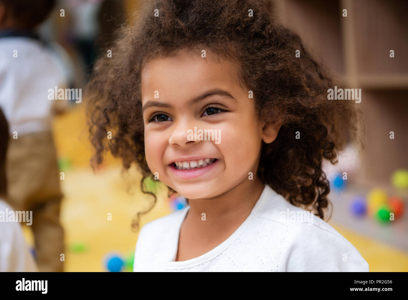 portrait of adorable smiling african american kid looking away in ...
