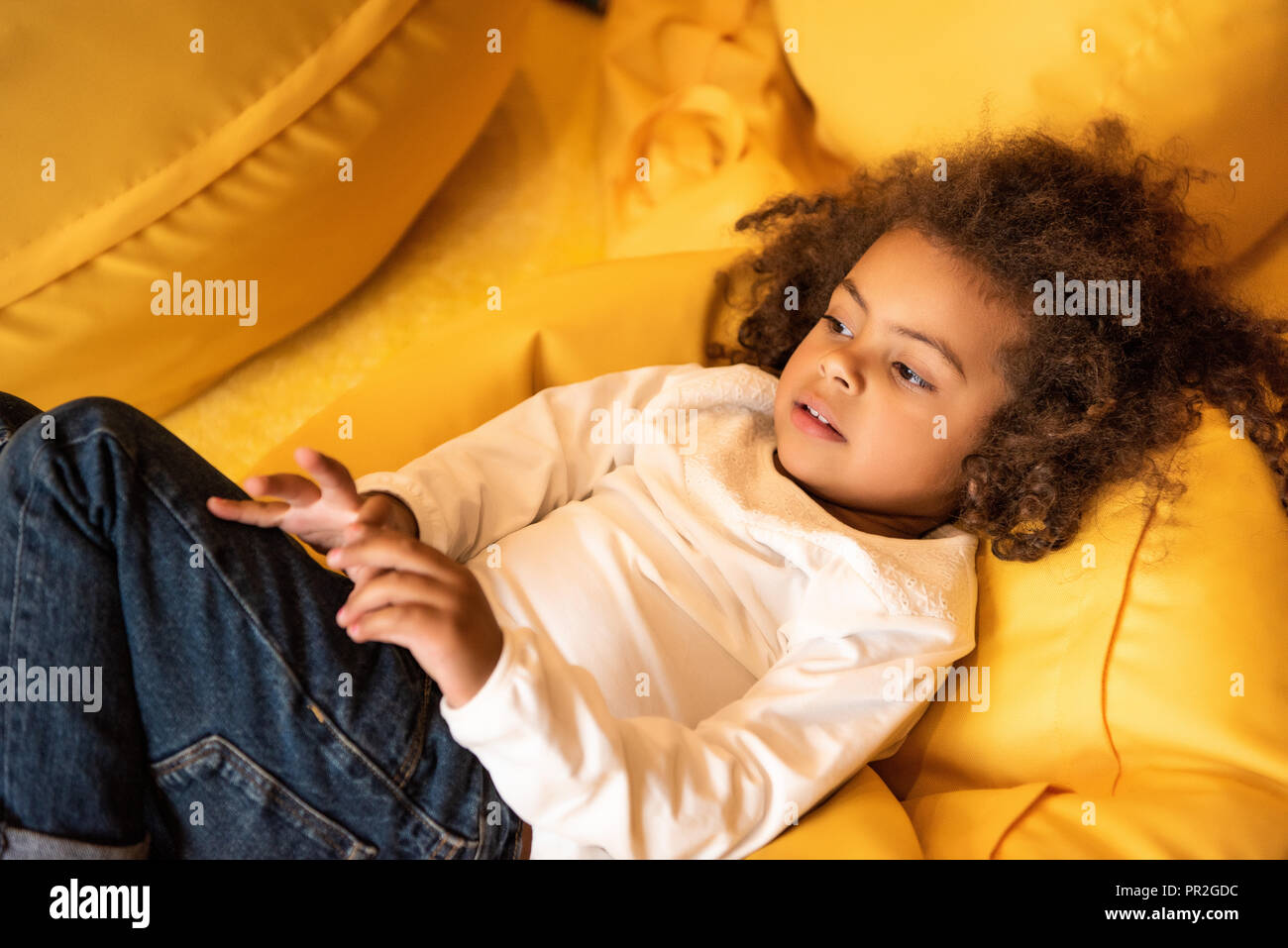Girl lying on bean bag hi-res stock photography and images - Alamy
