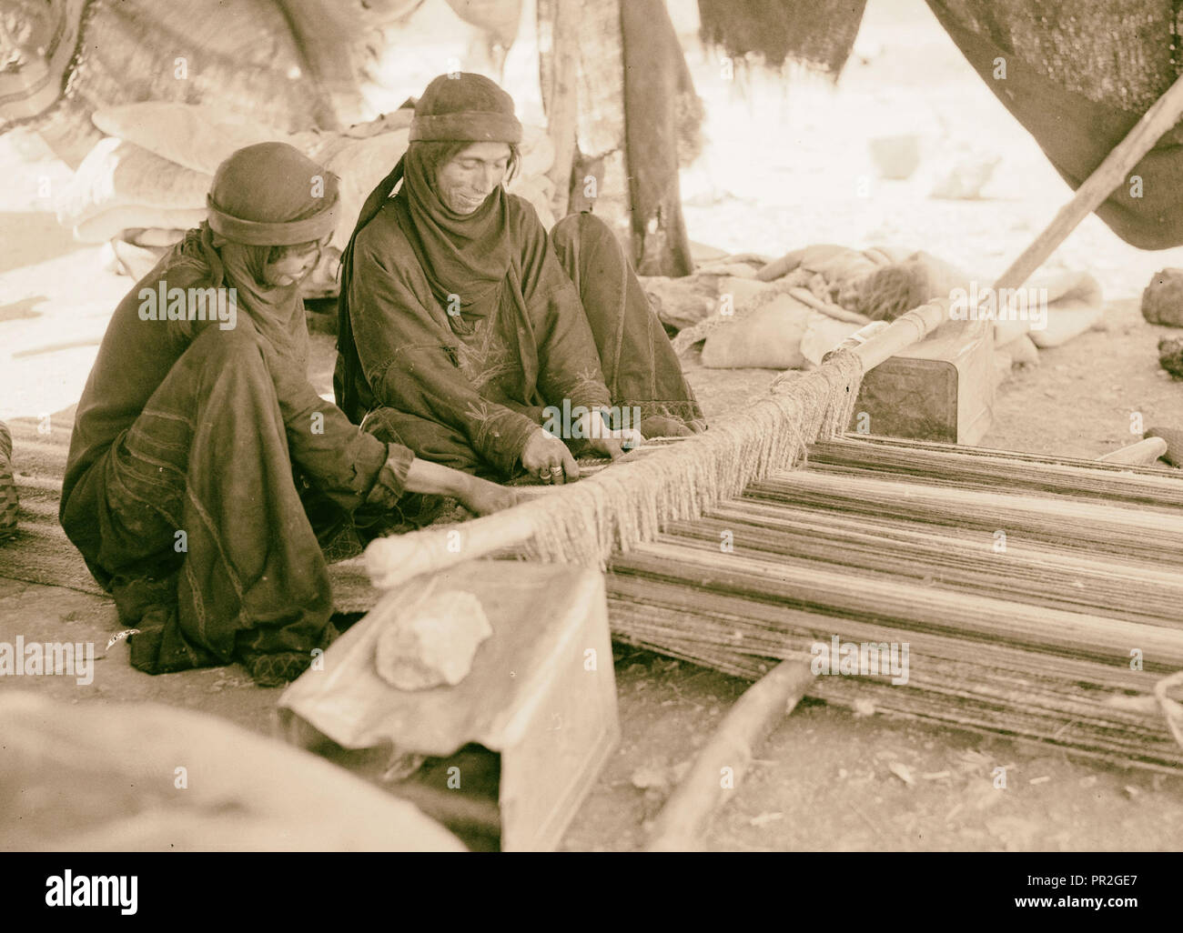 Bedouin women weaving. 1940, Middle East, Israel and/or Palestine Stock Photo