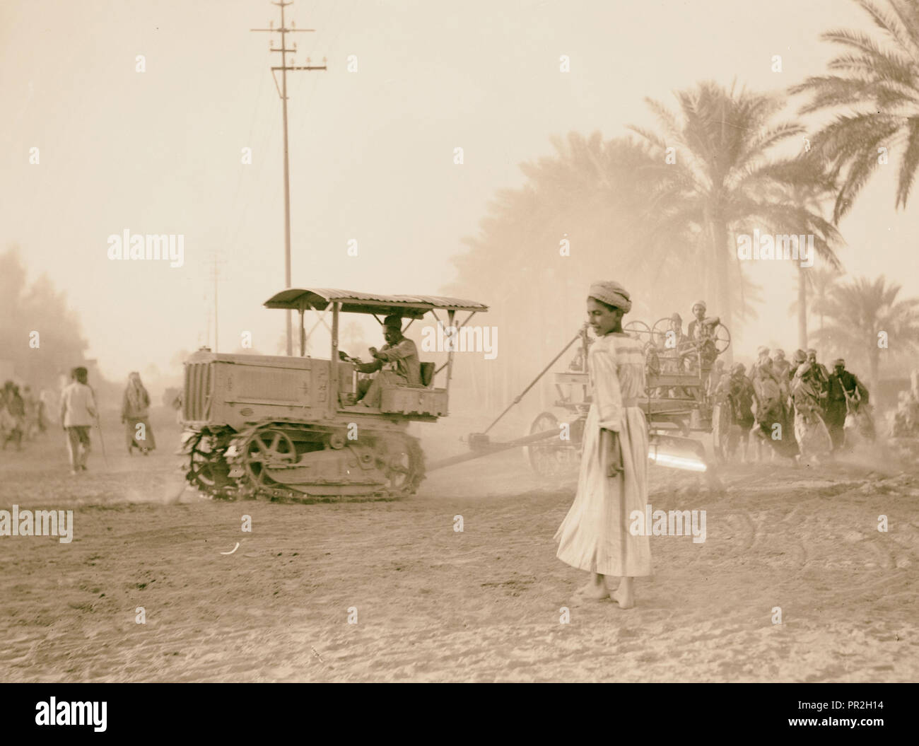 Medical College, Baghdad & road bldg. [i.e., building], Tractor pulling cart. 1932, Iraq, Baghdad Stock Photo