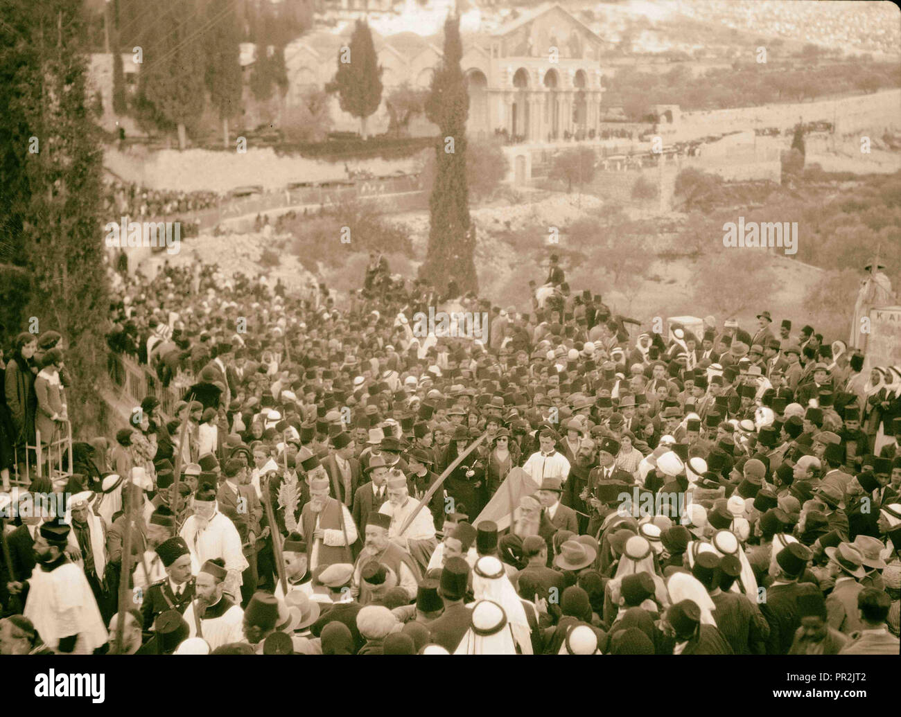 Centennial Easter celebrations. Holy Year. Palm Sunday procession, Bethany to Jerusalem. Passing the Garden of Gethsemane, April Stock Photo