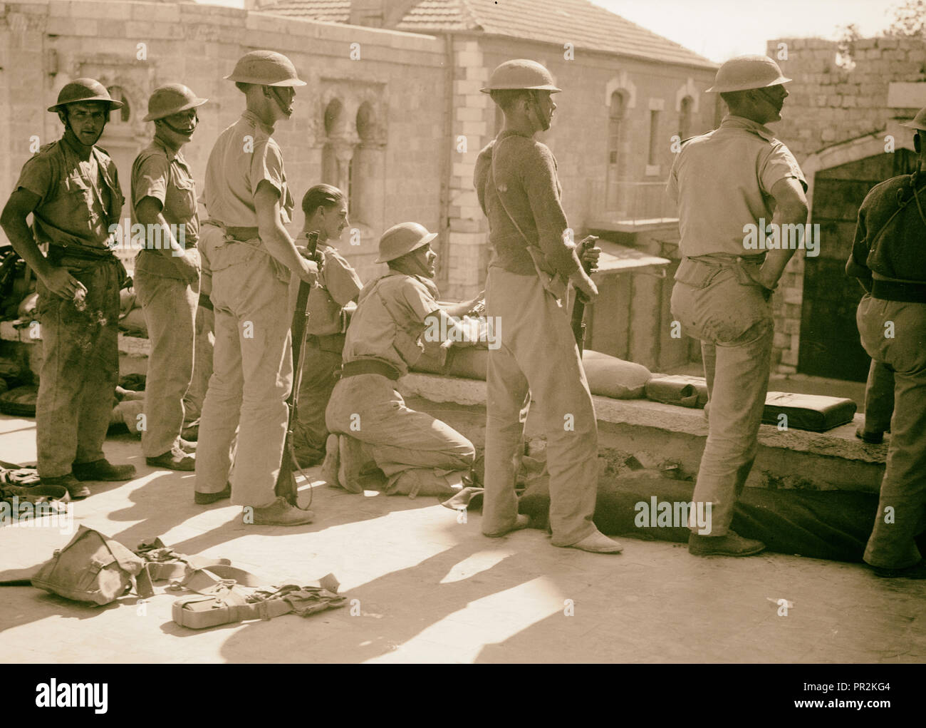 Troops behind sand bags on wall of French hospital. Close-up view of New Gate, Jerusalem, Israel Stock Photo