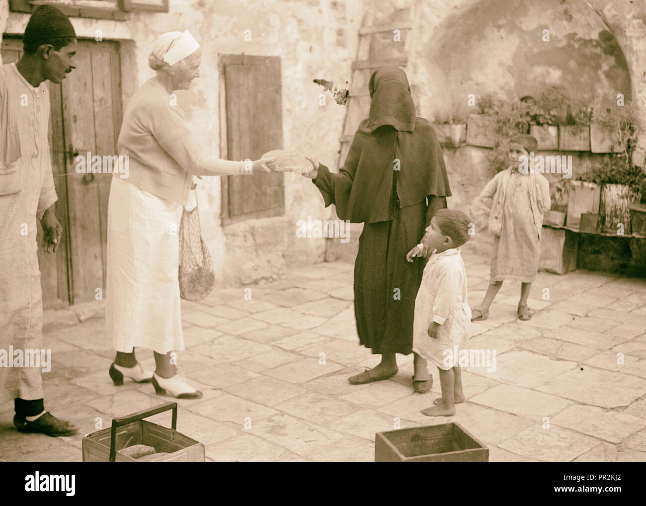The raising of the siege of Jerusalem. Scene in the courtyard of a poor Moslem [i.e., Muslim] Home, showing Mrs. F. Vester Stock Photo