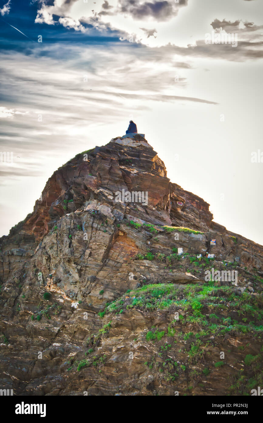 Person sitting on the top of a mountain Stock Photo - Alamy