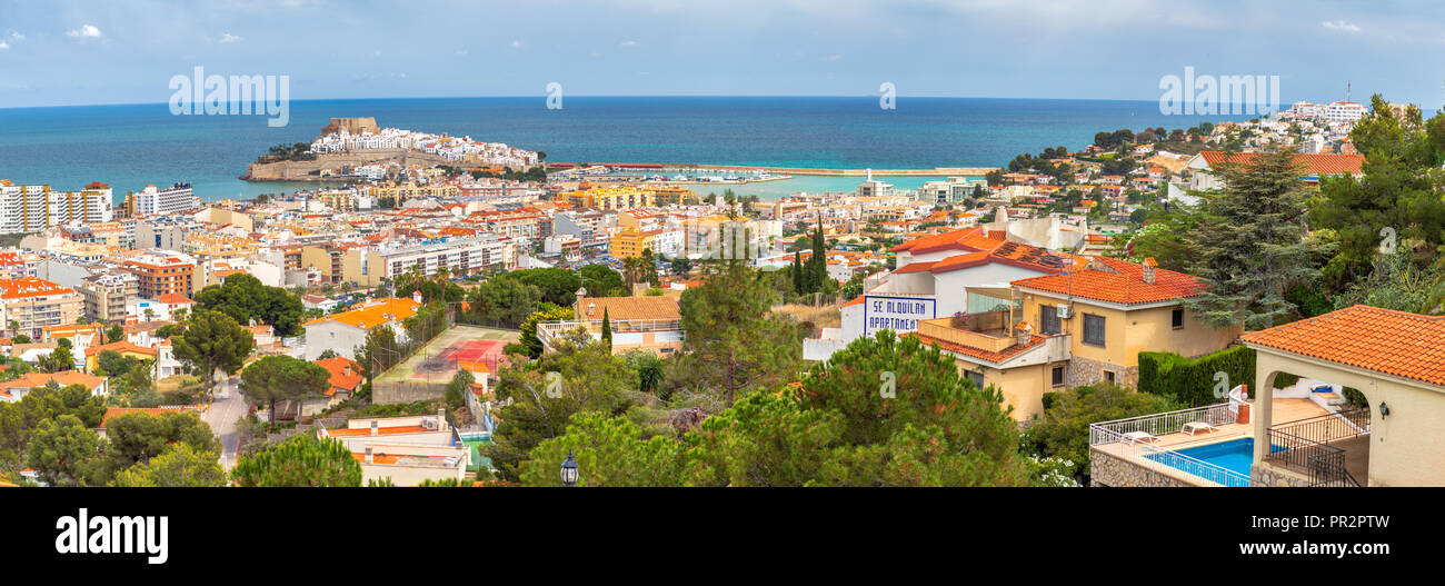 Panoramic sunny daytime view of the town and seaport of Peñiscola with the castle in the distance on the Balearic Sea Stock Photo