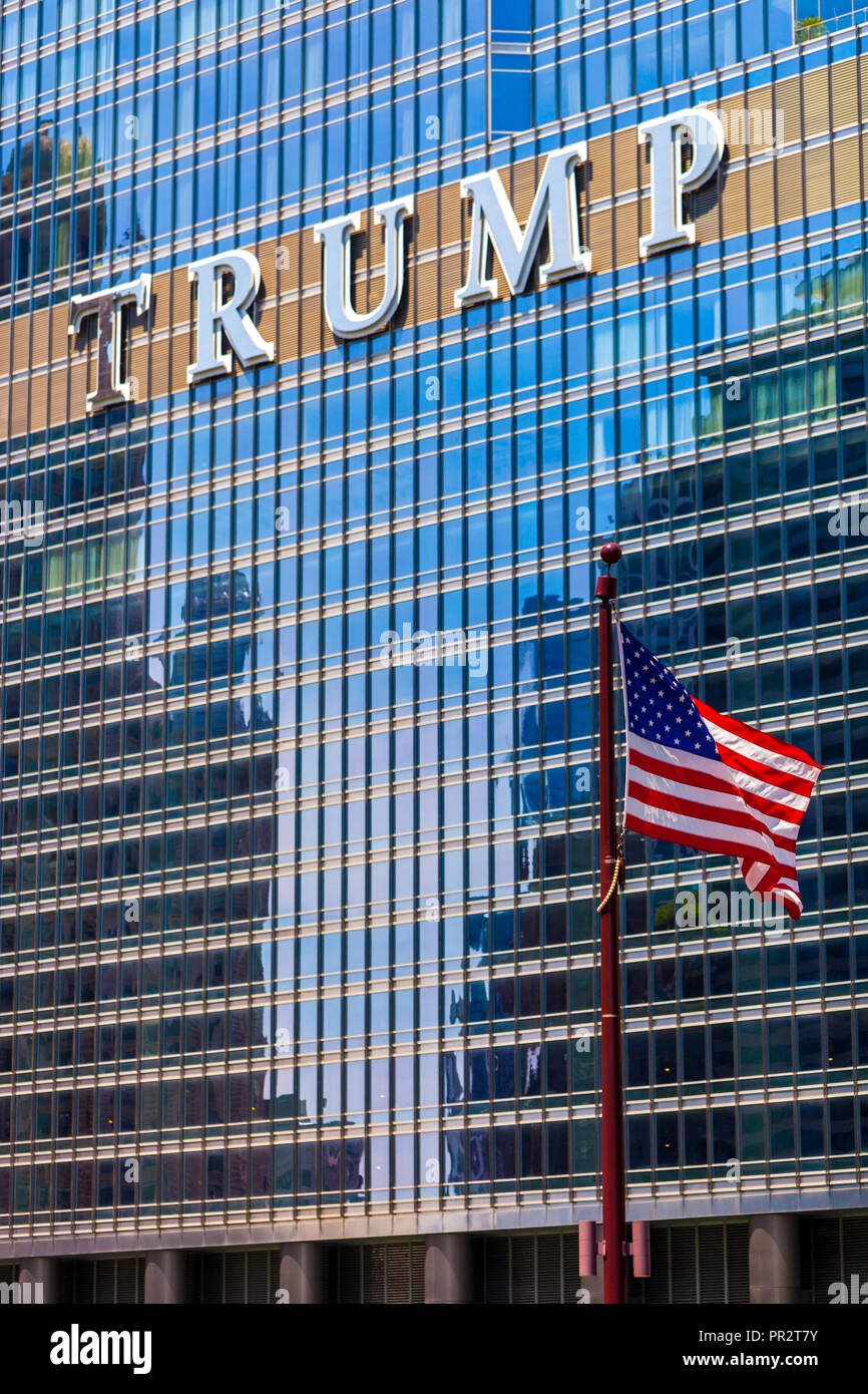 CHICAGO, ILLINOIS - JULY 10. 2018 - The American flag waving in front of the The Trump International Hotel and Tower located in downtown Chicago Stock Photo