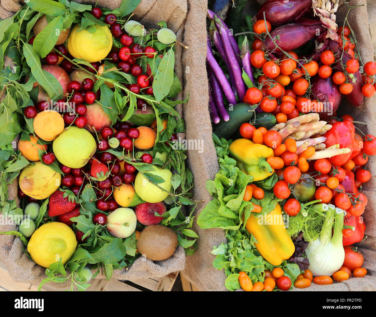 two boxes of fruits and vegetables for sale at supermarket Stock Photo ...