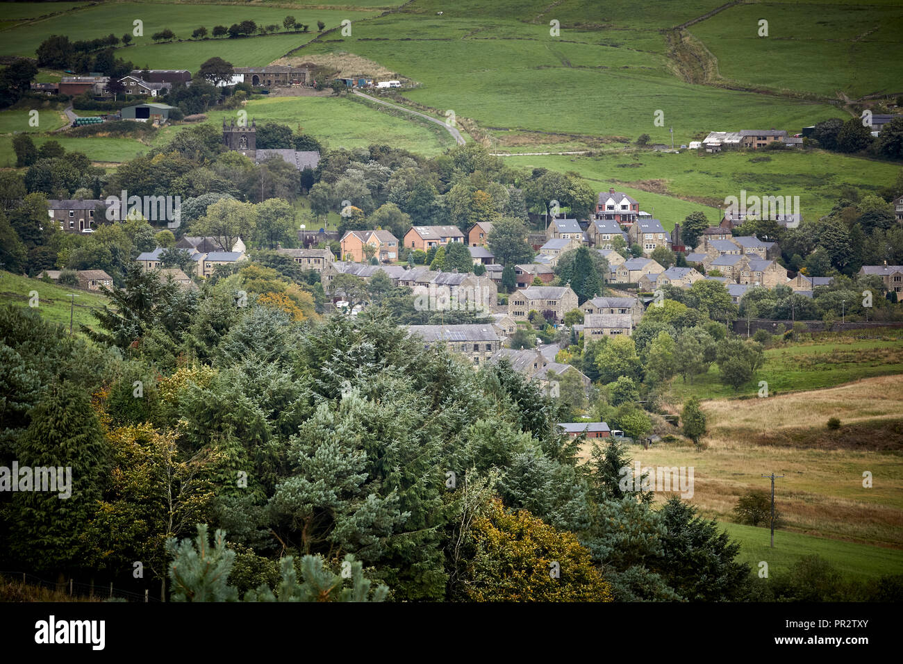 Housing stock in the rural valley village Denshaw in Saddleworth a civil parish of the Metropolitan Borough of Oldham, Greater Manchester, England Stock Photo