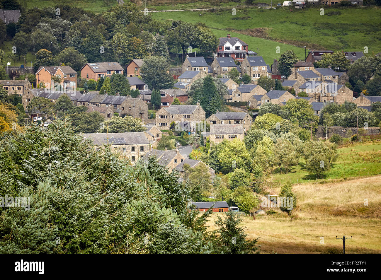 Housing stock in the rural valley village Denshaw in Saddleworth a civil parish of the Metropolitan Borough of Oldham, Greater Manchester, England Stock Photo