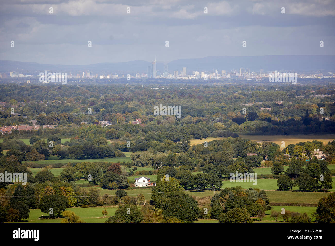Alderley Edge, Cheshire, View from the Edge looking across the flat plain to manchester city centre skyline Stock Photo