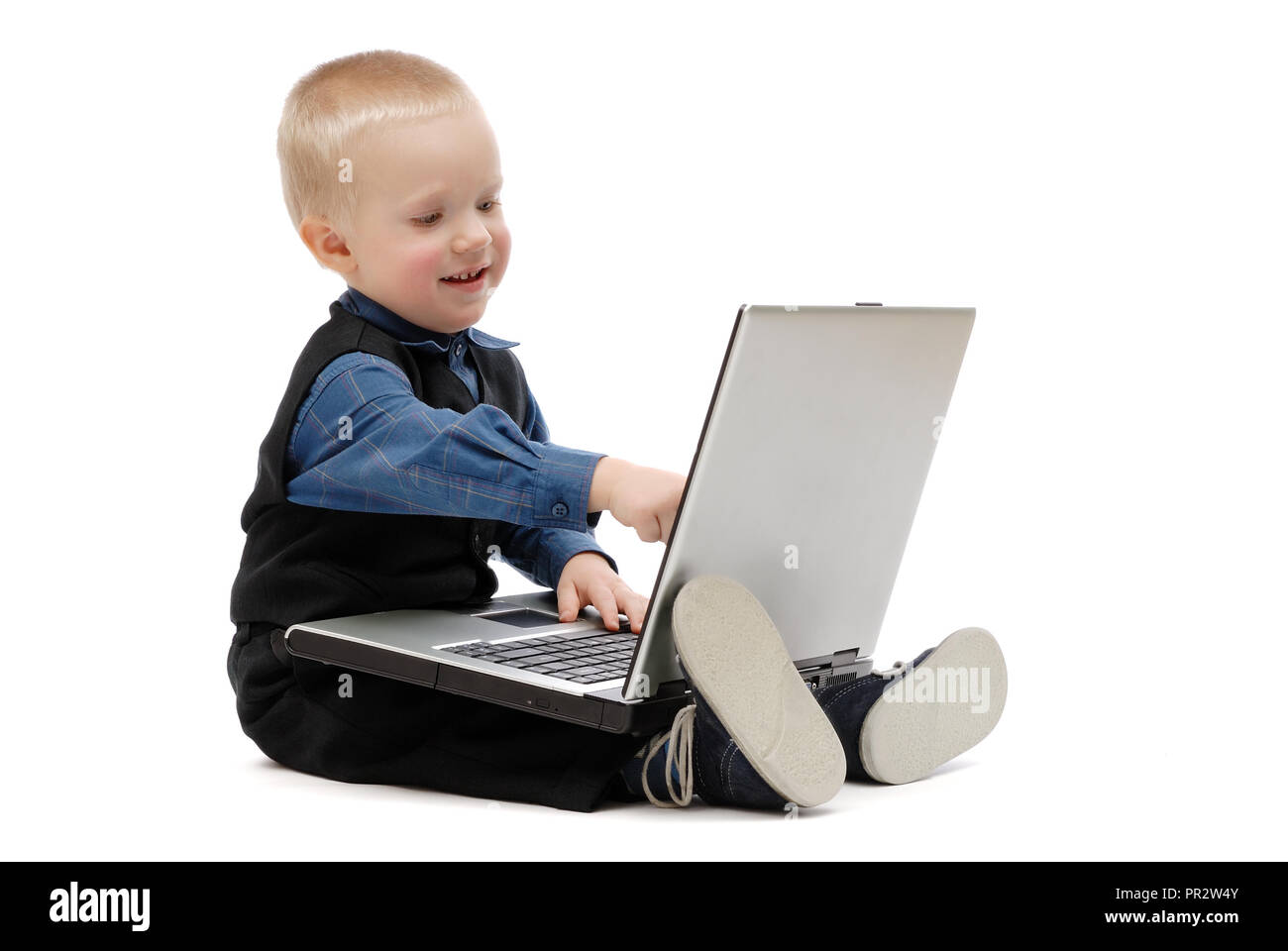 Little boy with a laptop on white background, isolated Stock Photo - Alamy