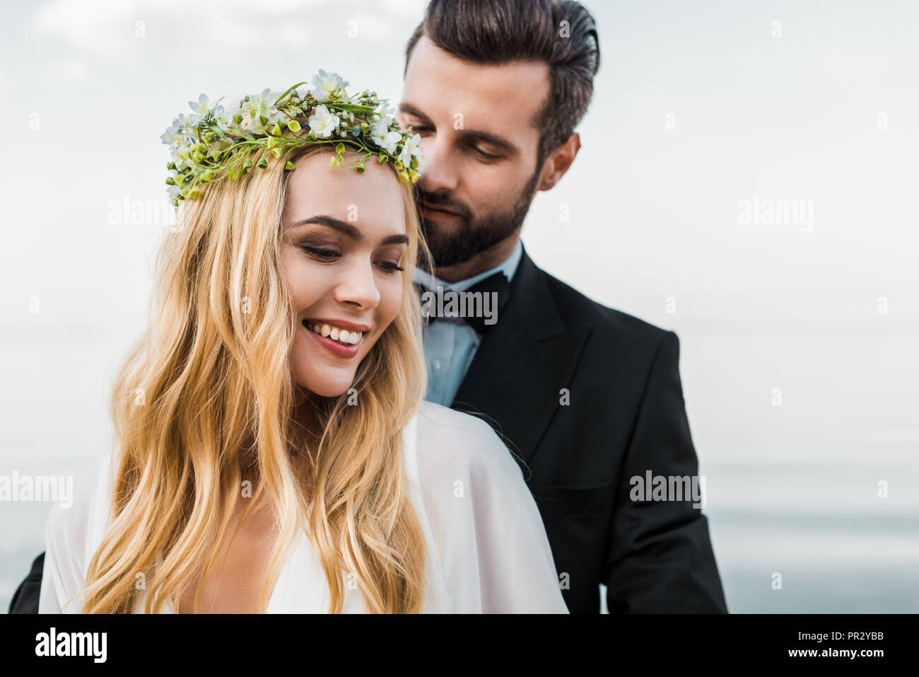 Portrait handsome groom hugging hi-res stock photography and images - Alamy