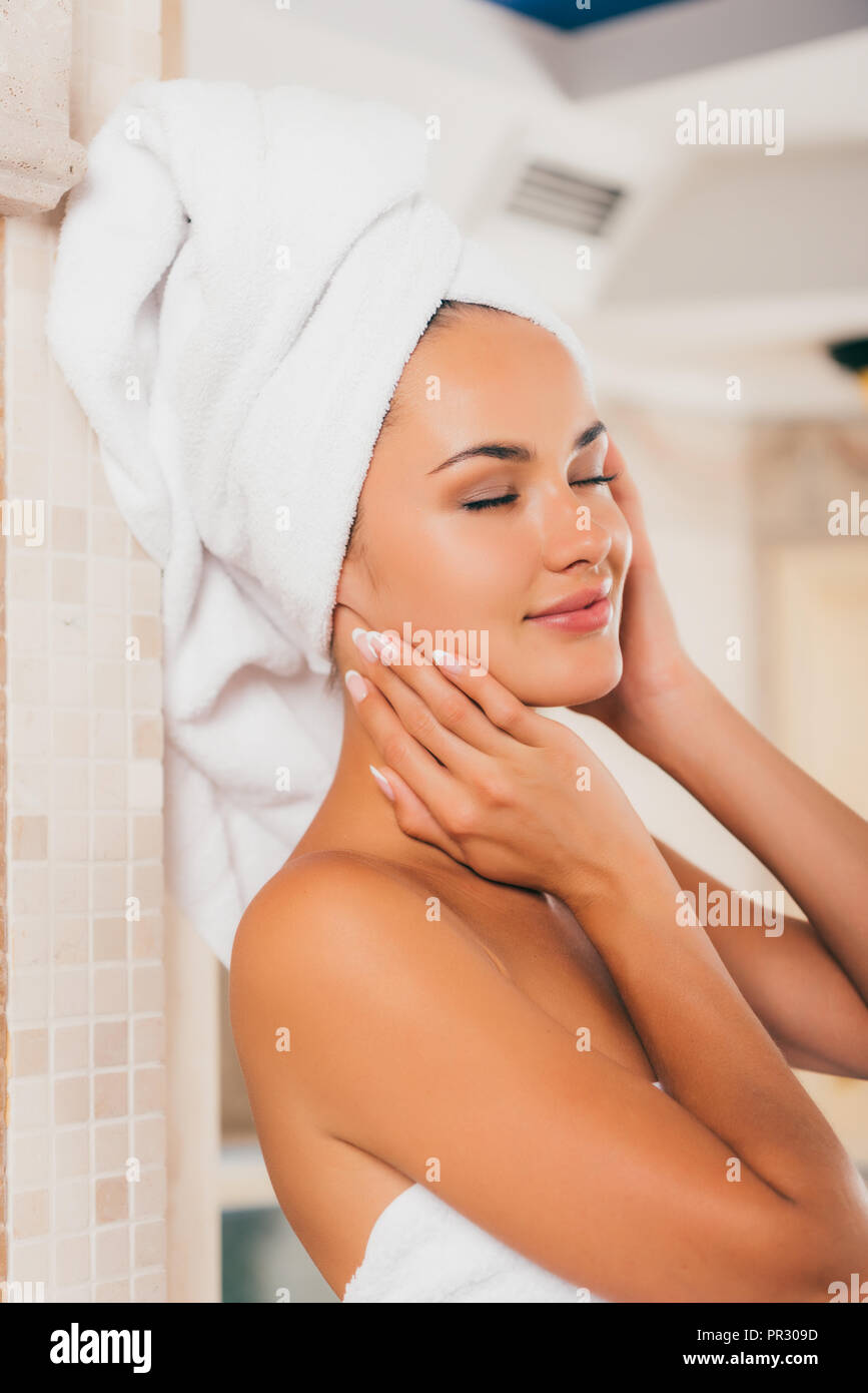 beautiful woman in white bath robe with perfect clean face Stock Photo