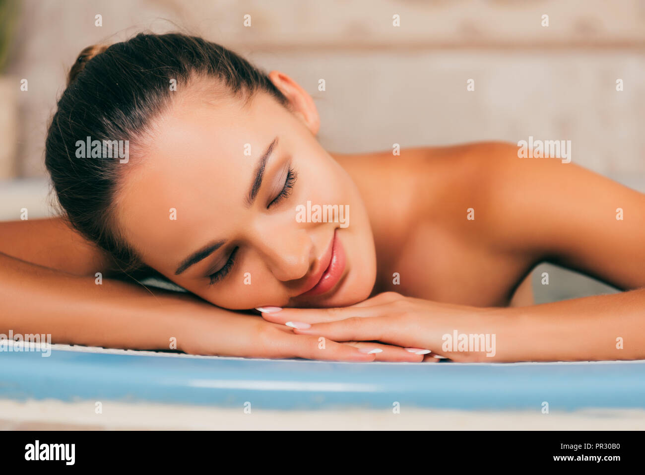 woman relaxing with closed eyes at spa salon Stock Photo - Alamy