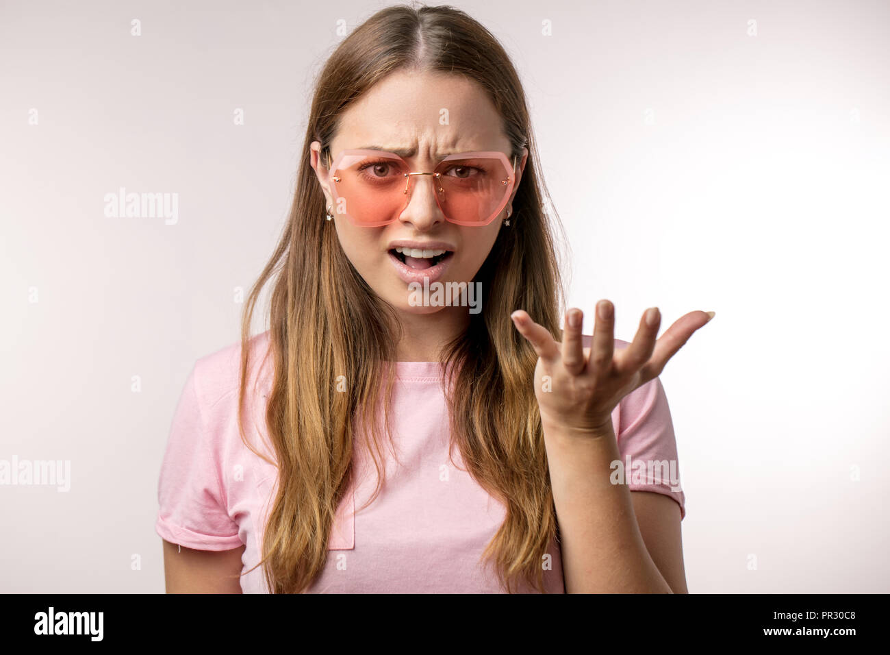emotional frustrated girl asking the question Stock Photo - Alamy