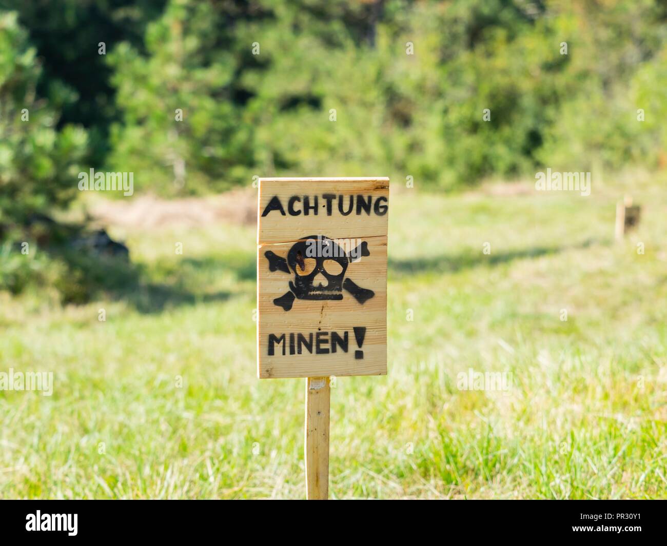 WW2 era historical history renovated in Pivka Museum Slovenia beware of mines mine-field warning sign Stock Photo